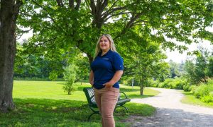 Joni standing in a park